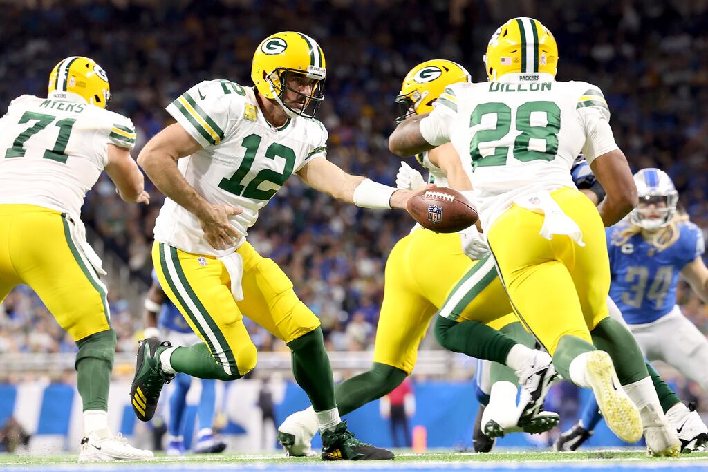 Aaron Rodgers of the Green Bay Packers hands the ball off to AJ Dillon during his side's loss to the Detroit Lions at Ford Field on Sunday. Photograph: Rey Del Rio/Getty Images