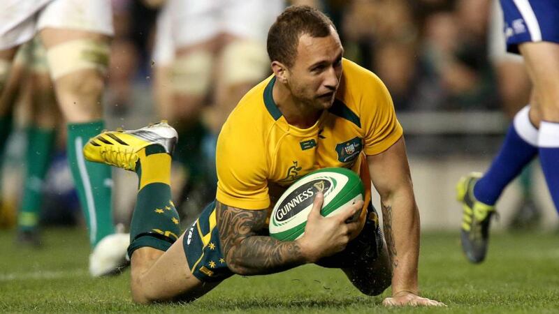Australia’s Quade Cooper scores their third try of the game. Photograph: Ryan Byrne/Inpho