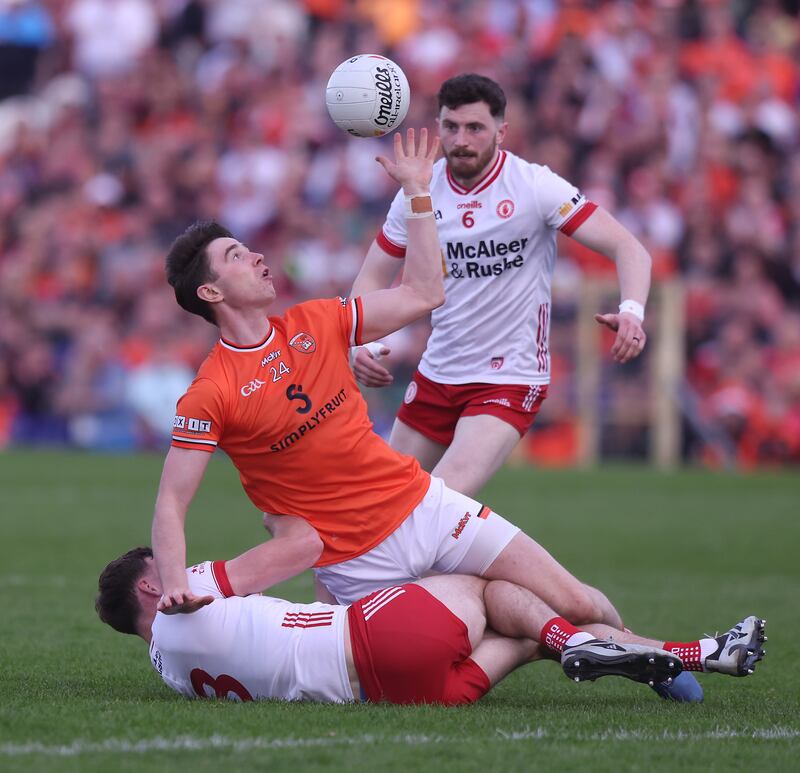Armagh's Ben Crealey and Tyrone's Brian Kennedy. Photograph: John McVitty/Inpho