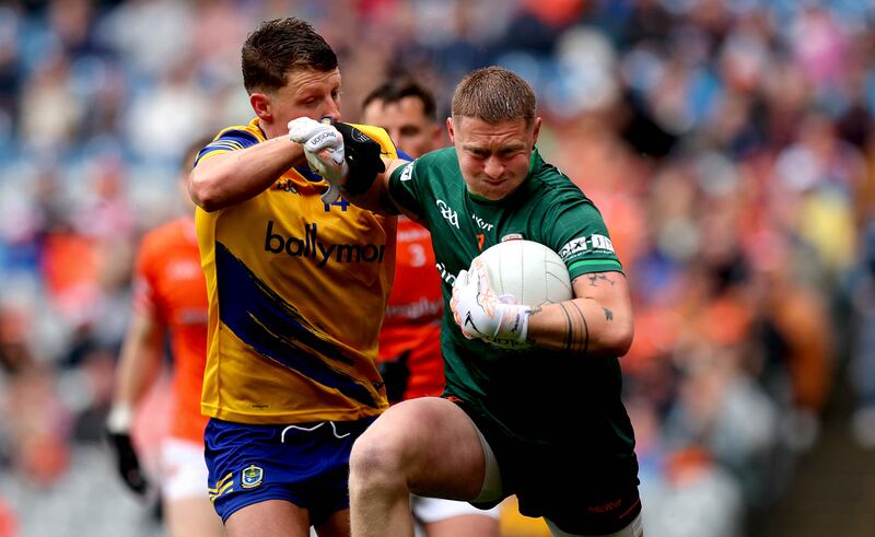 Armagh goalkeeper Blaine Hughes and Conor Cox of Roscommon. Photograph: Ryan Byrne/Inpho