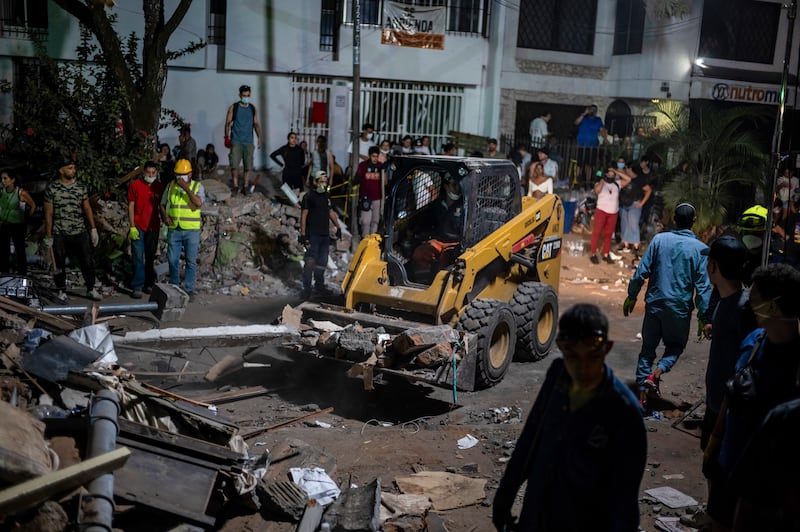 Rubble is removed from the street as people search for survivors in Cali, Colombia, on Monday. Photograph: Federico Rios/The New York Times