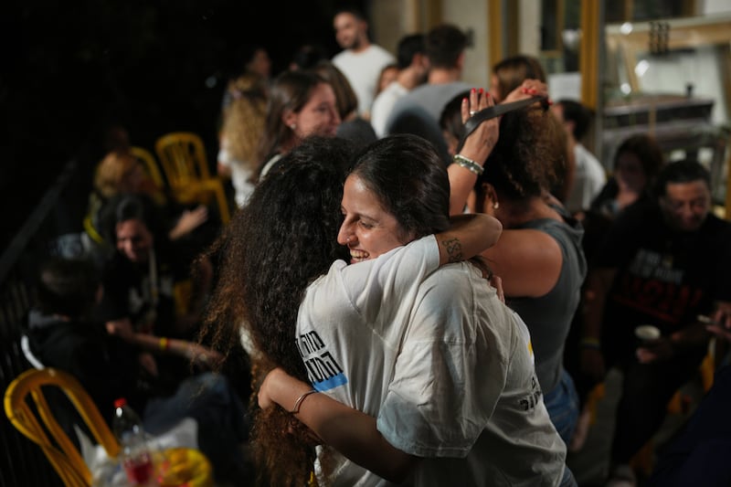 Relatives and supporters of Israeli hostages held by Hamas in the Gaza Strip celebrate after the announcement that Israel and Hamas have agreed to the first phase of a peace plan (Emilio Morenatti/AP)