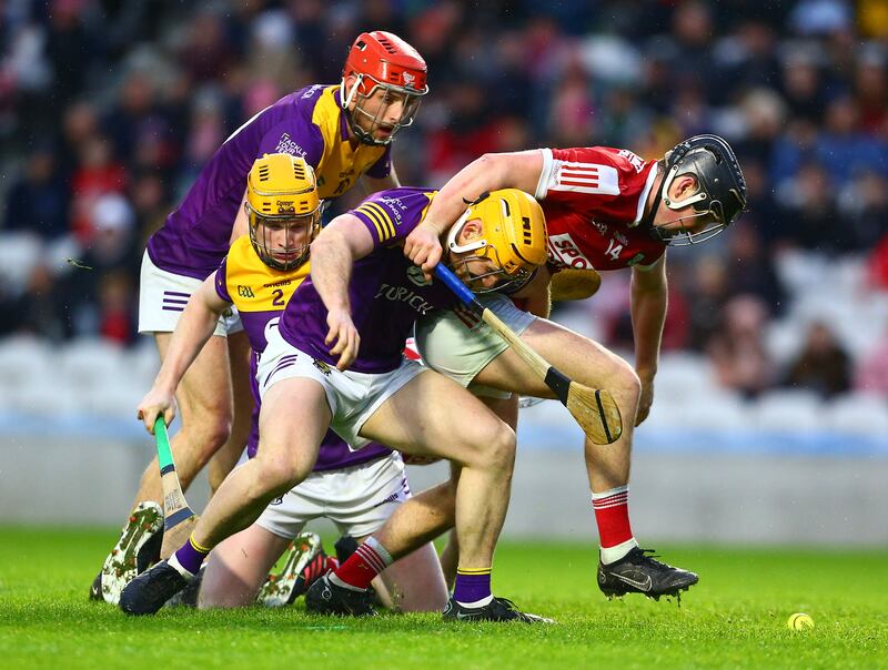 Cork’s Padraig Power prevents Wexford’s David Clarke from getting the ball. Photograph: Ken Sutton/Inpho