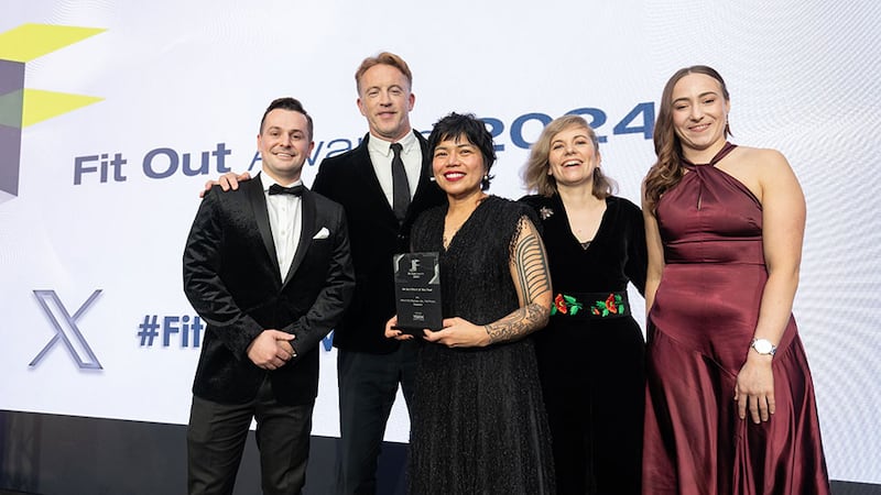 Aaron O'Grady, CEO of Vibe by Vision x Magee, presents the fit out client of the year award to Mola Architecture, JLL, and T&I Fitouts team