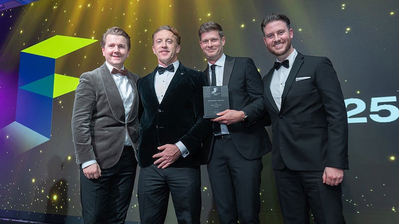 Aaron O'Grady, CEO, Vibe by Vision Acoustics & Sensory Solutions, presents the fit out client of the year award to Mola Architecture team