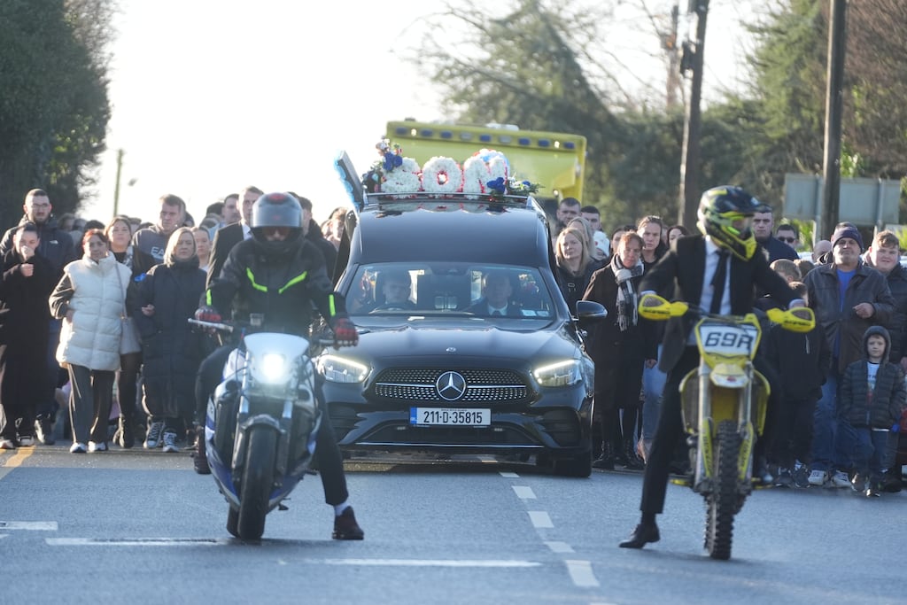 The cortege, led by two motorcyclists, arrives for the funeral of Tadgh Farrell at St Mary's Church, Edenderry, on Friday. Photograph: Brian Lawless/PA Wire