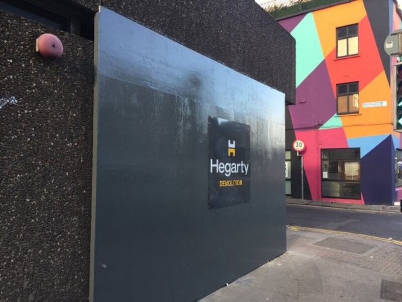 Hoarding was erected at Apollo House in early December by Hegarty Demolition. Photograph: Paddy Logue