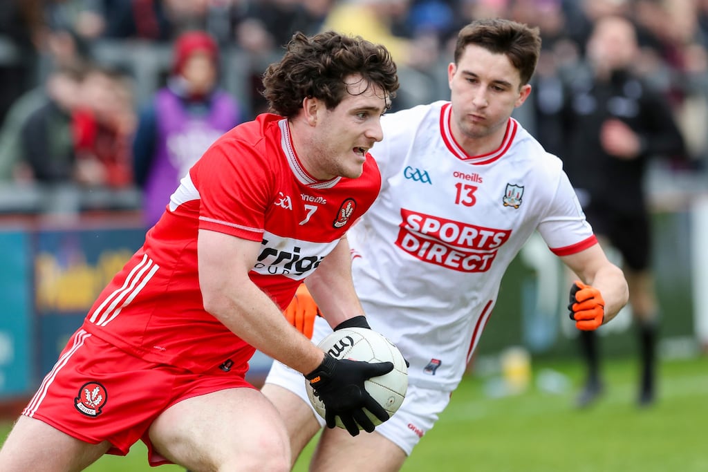 Derry's Padraig McGrogan and Cork’s Chris Óg Jones. Photograph: Lorcan Doherty/Inpho