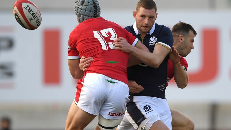 Scotland outhalf Finn Russell is sandwiched between Jonathan Davies (left) and Gareth Davies during the 2020 Guinness Six Nations match between Wales and Scotland. File photograph: Stu Forster/Getty Images