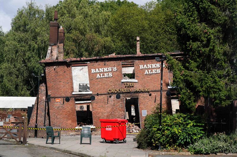 The Crooked House pub after it was burned down. Photograph:  Jacob King/PA Wire 