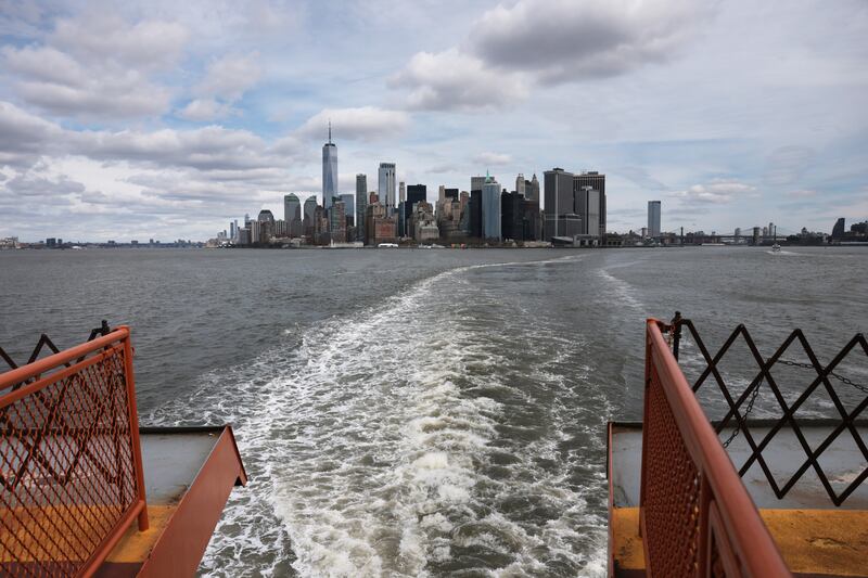Lower Manhattan and the Financial District stand in the distance from the Staten Island Ferry. Stocks on Wall Street were down sharply in as events in the Middle East continue to roil markets worldwide.  (Photo by Spencer Platt/Getty Images)