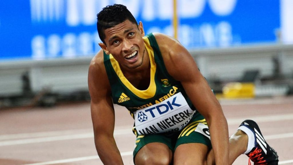 Wayde Van Niekerk of South Africa falls on the track after winning the men’s 400m final during the Beijing 2015 IAAF World Championships at the National Stadium. Photo: Franck Robichon/PA