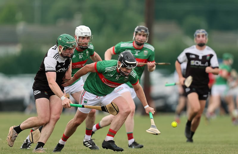 JK Brackens' Éanna McBride and Tómas McGrath of Loughmore-Castleiney. Photograph: Bryan Keane/Inpho