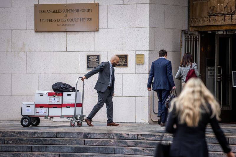 Boxes of documents are carried into the Los Angeles superior court. Photograph: Ethan Swope/Getty Images