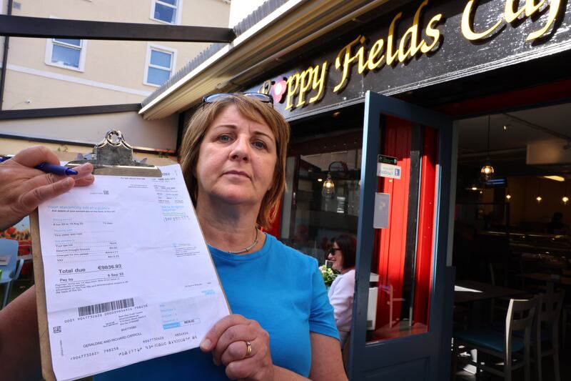 Geraldine Dolan at Poppy Fields cafe, Athlone, Co. Westmeath, holds up her electricity bill, almost €10,000 for 73 days. Photograph: Dara Mac Dónaill








Photograph: Dara Mac Donaill / The Irish Times