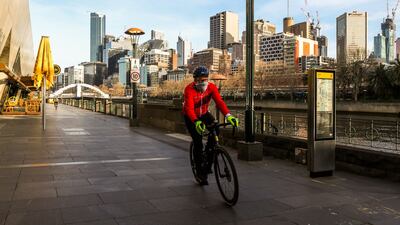 A lone cyclist rides along the usually busy Southbank in Melbourne. Photo: Asanka Ratnayake/Getty Images