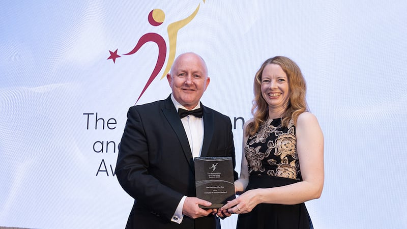 Odhrán Allen, awards judge, presents the best institute of the year award to Anne Mannion, Institute of Directors Ireland