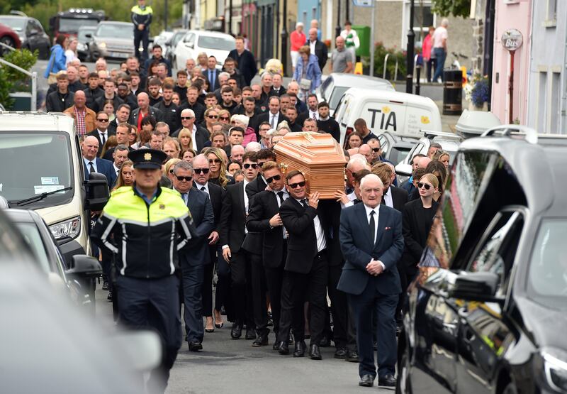 Ronan Keating (centre middle left) helps carry the coffin of his brother Ciaran Keating towards St Patrick's Church in Louisburgh, Co Mayo, for his funeral. The older brother of Ronan Keating died in a two-car crash near Swinford in Co Mayo on Saturday. Photograph: Oliver McVeigh/PA Wire