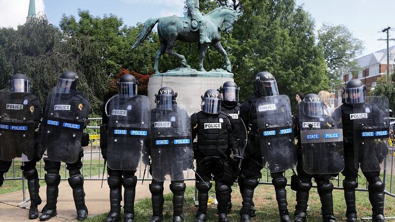 Virginia State Police in riot gear stand in front of the statue of General Robert E Lee before forcing white nationalists, neo-Nazis and members of the ‘alt-right’ out of Emancipation Park after the ‘Unite the Right’ rally was declared an unlawful gathering August 12th, 2017 in Charlottesville. Photograph: Chip Somodevilla/Getty Images
