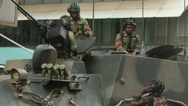 Soldiers are seen on the armoured vehicle outside the parliament in Harare, Zimbabwe on Wednesday. Photograph: Philimon Bulawayo/Reuters