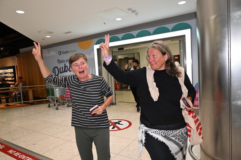 Sarah Clancy (left) and Donna Schwarz arrive home to Dublin Airport after detention in Israel. Photograph: Bryan Meade