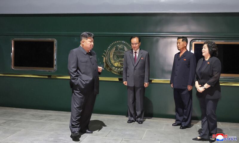 Kim Jong-un stands by his private train in Pyongyang before departing for Beijing on Monday. Photograph: North Korean Central News Agency/EPA