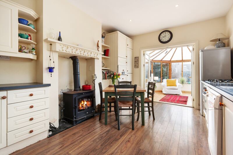 Kitchen with conservatory at end.