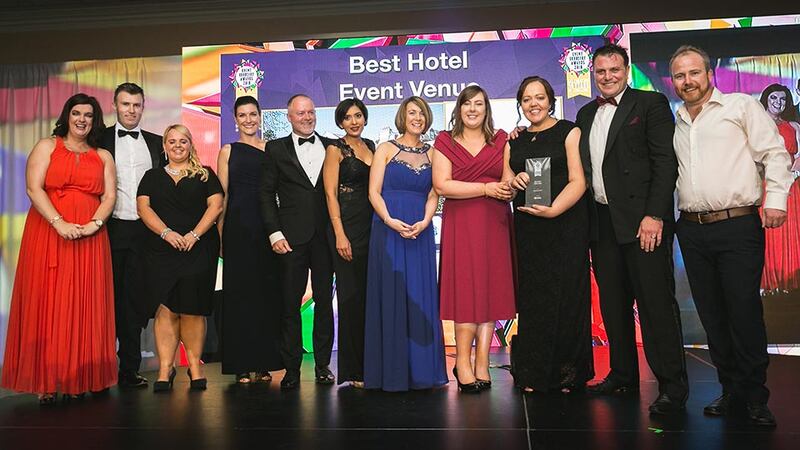 Dagan Fleming, Sales Manager, Stage & Lighting presents the Best Hotel Event Venue award to Citywest Hotel team.