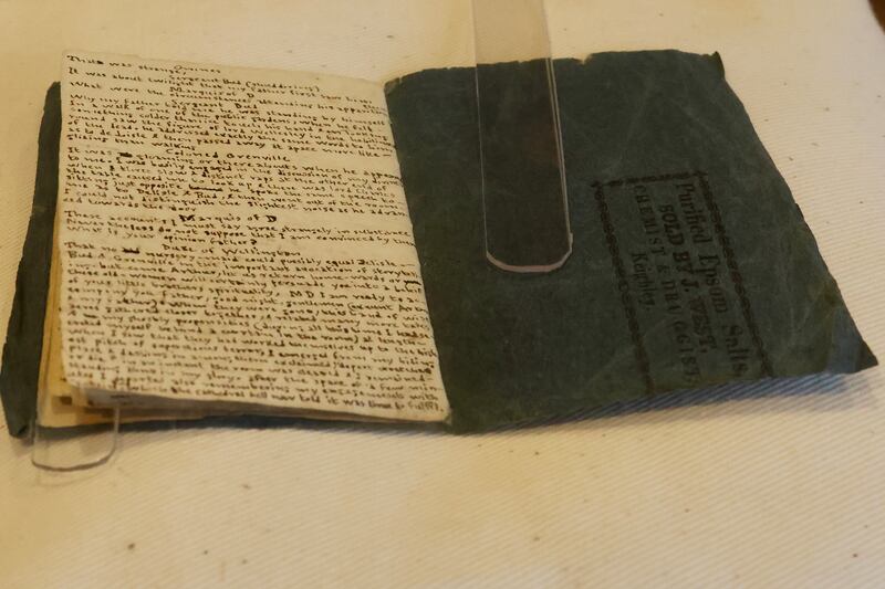 Charlotte Brontë's handwriting on a mock newspaper she wrote when she was 13 on an Epsom salts wrapper