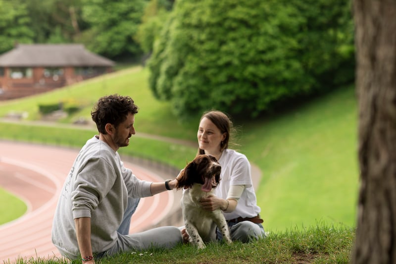 Ciara Mageean, her partner Tommy and her dog Sam at the Mary Peters Track in Belfast. Photograph: Evanna Devine