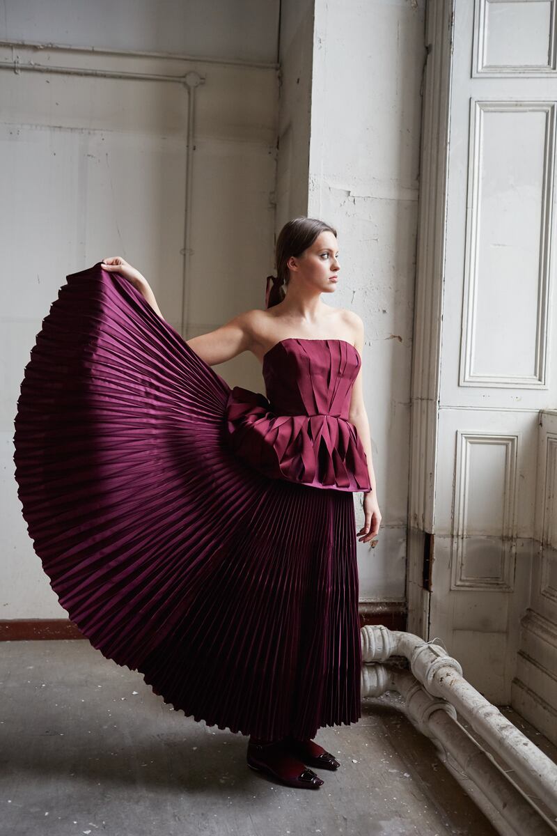 Prune origami ribboned silk and viscose pleated peplum corset with origami pleated skirt