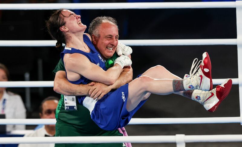 Kellie Harrington celebrates with coach Zaur Antia after winning gold at the Paris Olympics in August. Photograph: Ryan Byrne/Inpho