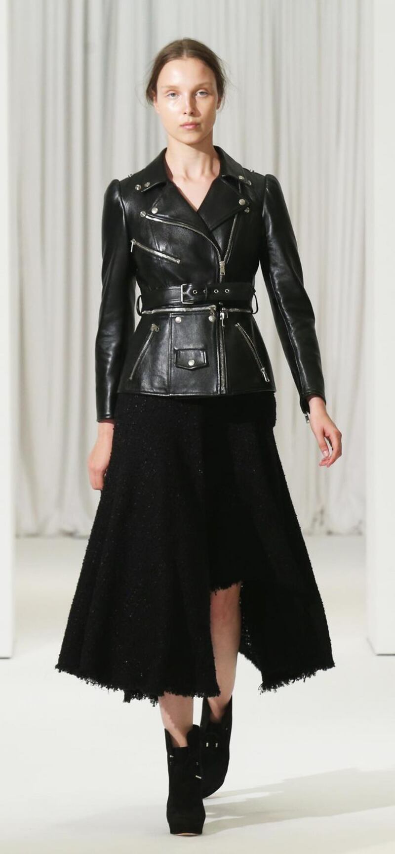 Tailored black leather jacket and skirt by Alexander McQueen