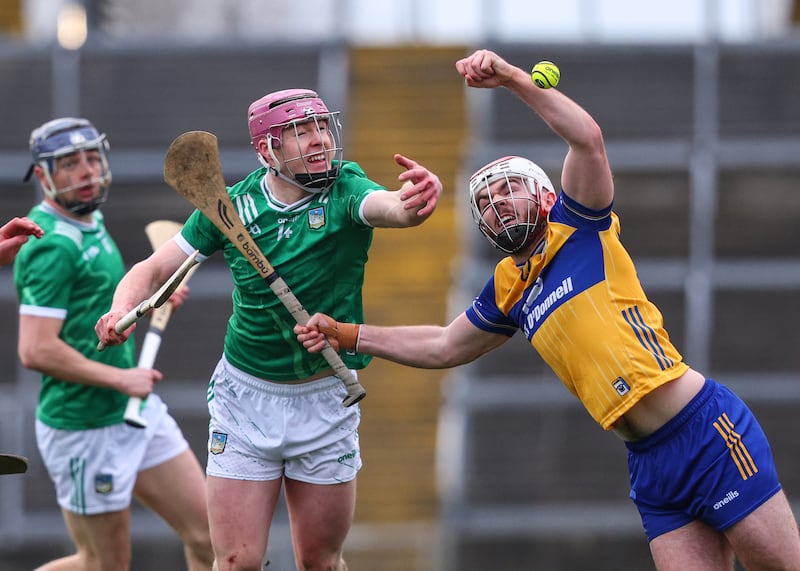 Limerick's Shane O'Brien competes for a ball with Conor Leen of Clare during the Allianz Hurling League Division 1A game at the TUS Gaelic Grounds. Photograph: Ben Brady/Inpho
