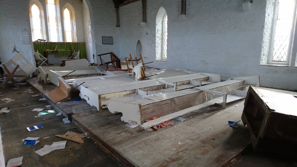 The scene of devastation at Holy Trinity Church near Clifden, Co Galway, where pews and pulpit were turned over and smashed, electrics ripped out, and both organs turned to matchwood