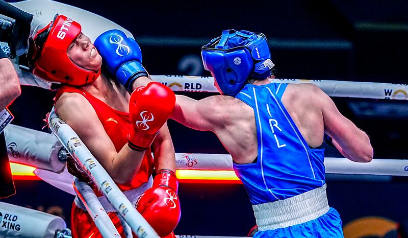 Ireland's Aoife O'Rourke (Blue) and China's Lina Wang (Red) fight. Photograph: Peter Byrne/PA