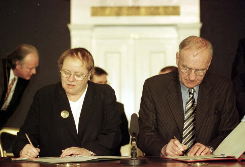 Northern secretary Mo Mowlam and minister for foreign affairs David Andrews sign agreements at Dublin Castle. Photograph: John Cogill
 