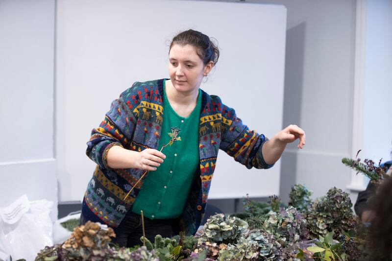 Abigail Flynn, psycho-social officer with Spirasi,  participates in the wreath-making workshop. Photograph: Tom Honan 
