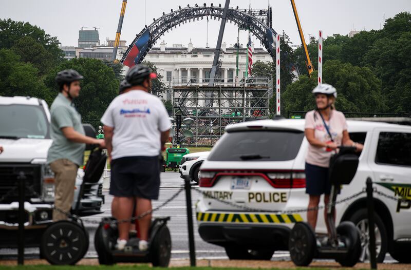 People on a Segway tour pass near the White House as construction continues for the upcoming UFC match. Photograph: Kevin Dietsch/Getty Images