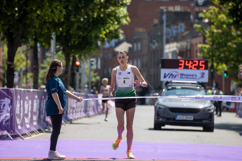 Nakita Burke of Letterkenny AC, Donegal, crosses the line to win the 2023 Vhi Women’s Mini Marathon. 

