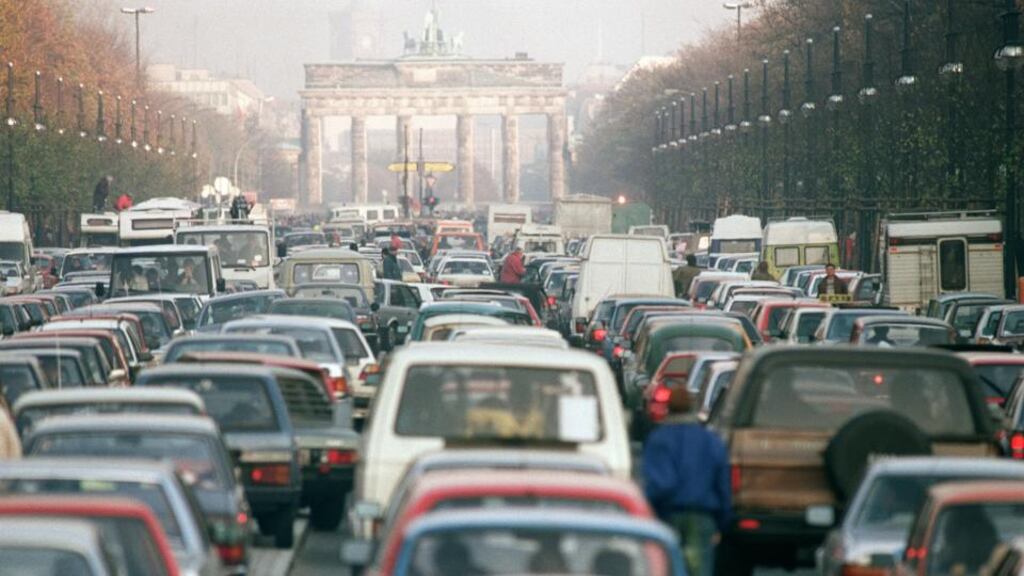 A convoy of East German cars queue up at Unter den Linden avenue in East Berlin before crossing the border line under the Brandenburg Gate into West Berlin as a result of the opening of the Berlin Wall on November 11th, 1989. Photograph: Derrick Ceyrac/AFP/ Getty Images