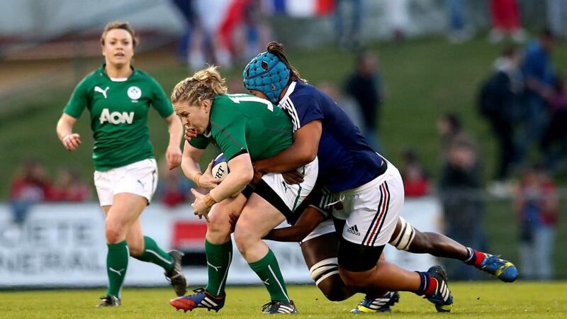 Ireland’s Niamh Briggs is tackled by  Coumba Diallo and Safi N’Diaye of France in Pau.  Photograph: James Crombie/Inpho