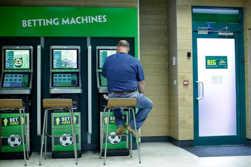 A man uses betting machines at a Paddy Power bookmaker's shop in London in 2015. File image. Photograph: Matthew Lloyd/Getty