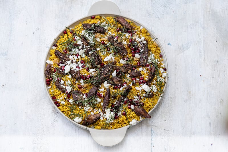 Spiced cous cous with crispy lamb shoulder and mint. Photograph: Harry weir