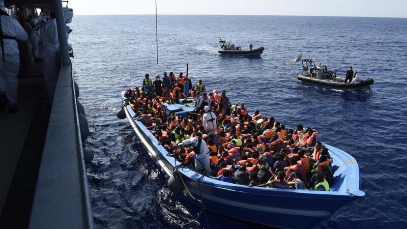 Handout photo issued by Irish Defence Forces of the operation by members of the Irish Navy vessel LÉ Eithne as they rescue refugees  in the Mediterranean. Photograph: David Jones/Irish Defence Forces/PA Wire