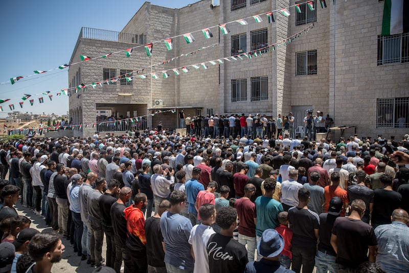 Men pray at the funeral for American citizen Sayfollah Musallet (20) and Palestinian Mohammed Hussein Al-Shalabi (23), in Al-Mazra’a ash-Sharqiya, the occupied West Bank. Photograph: Sally Hayden