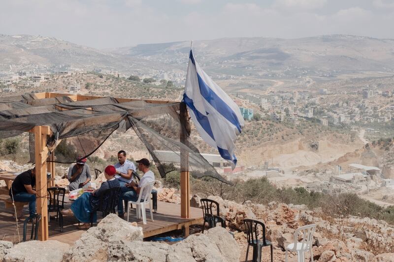 The Israeli settler outpost of Evyatar on Jabal Subeih overlooking the Palestinian village in Beita, West Bank. Photograph: Amit Elkayam/The New York Times
                      