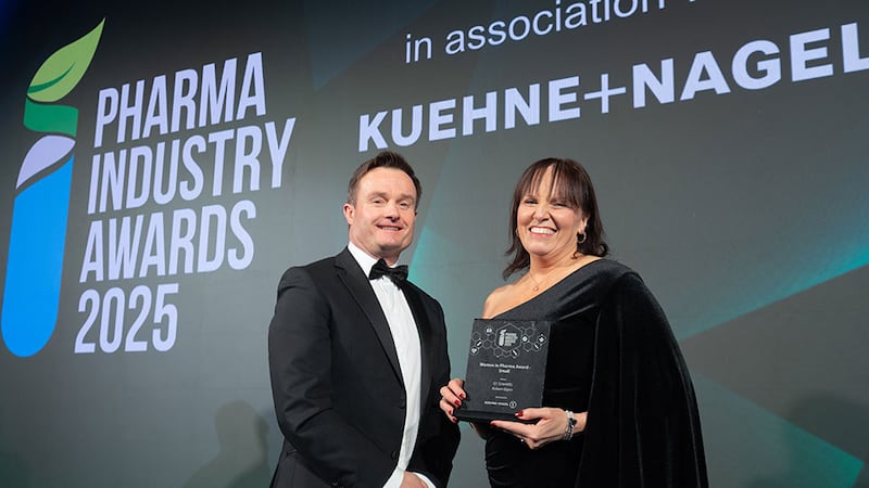 Graham O'Reilly, national road logistics manager, Ireland at Kuehne + Nagel, presents the women in pharma award - small to Aideen Glynn, Q1 Scientific