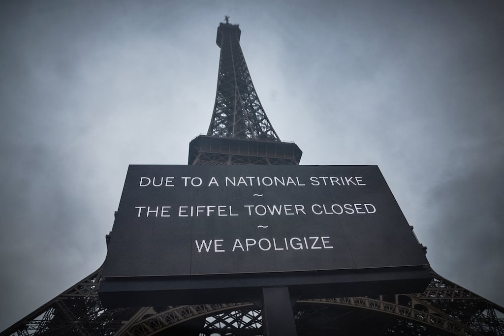 Visitors are informed that the Eiffel Tower is closed as staff strike over the financial management of the monument. Photograph: Kiran Ridley/AFP