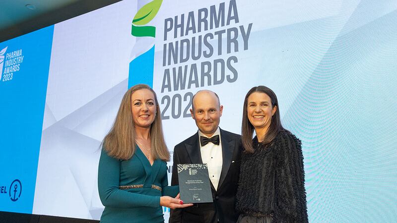 Susan Costello, network director at BioPharmaChem Skillnet, presents graduate training programme of the year award to Pamela O'Brien and Padraig Keane, Bristol Myers Squibb